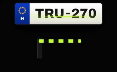 Camera reading a licence plate at the barrier