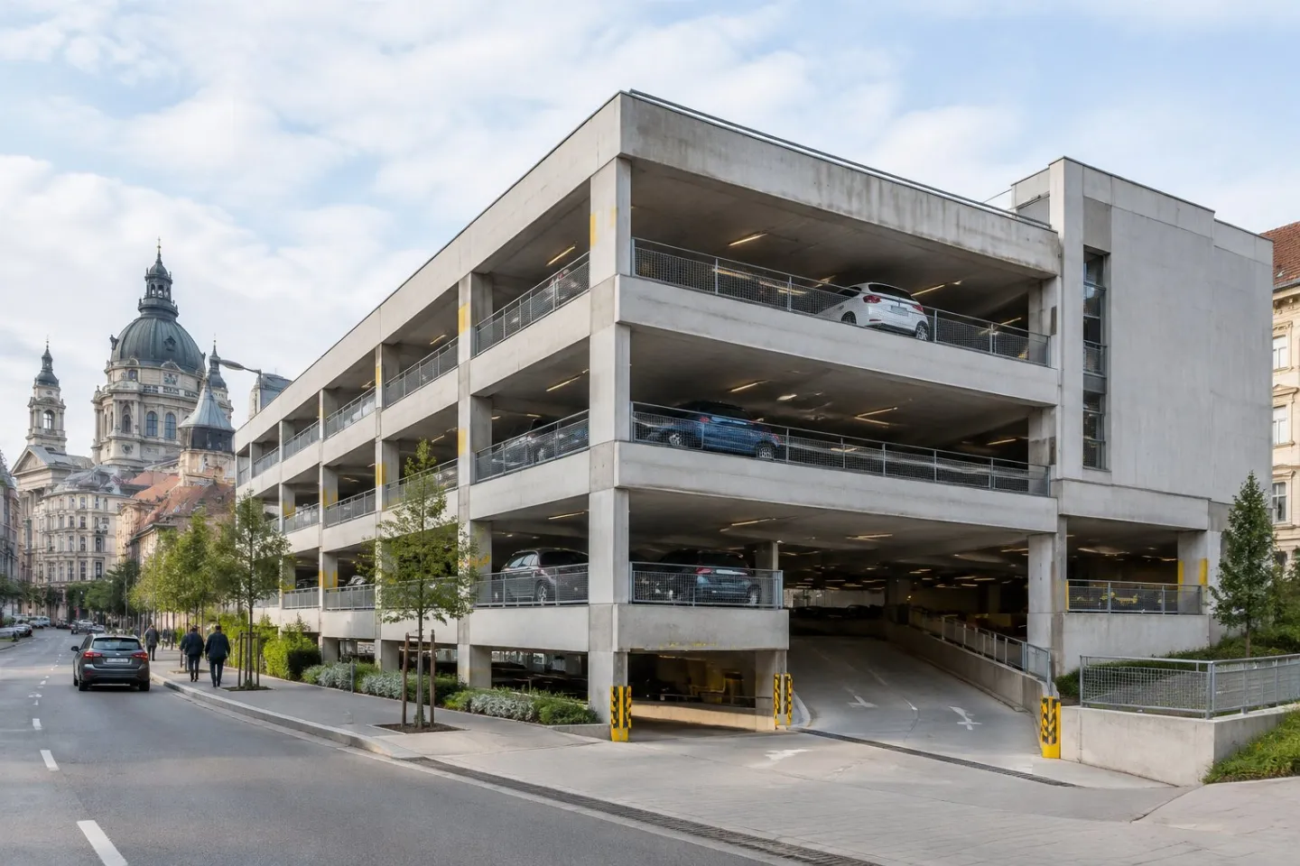 A modern multi-level parking garage in an urban Budapest setting.