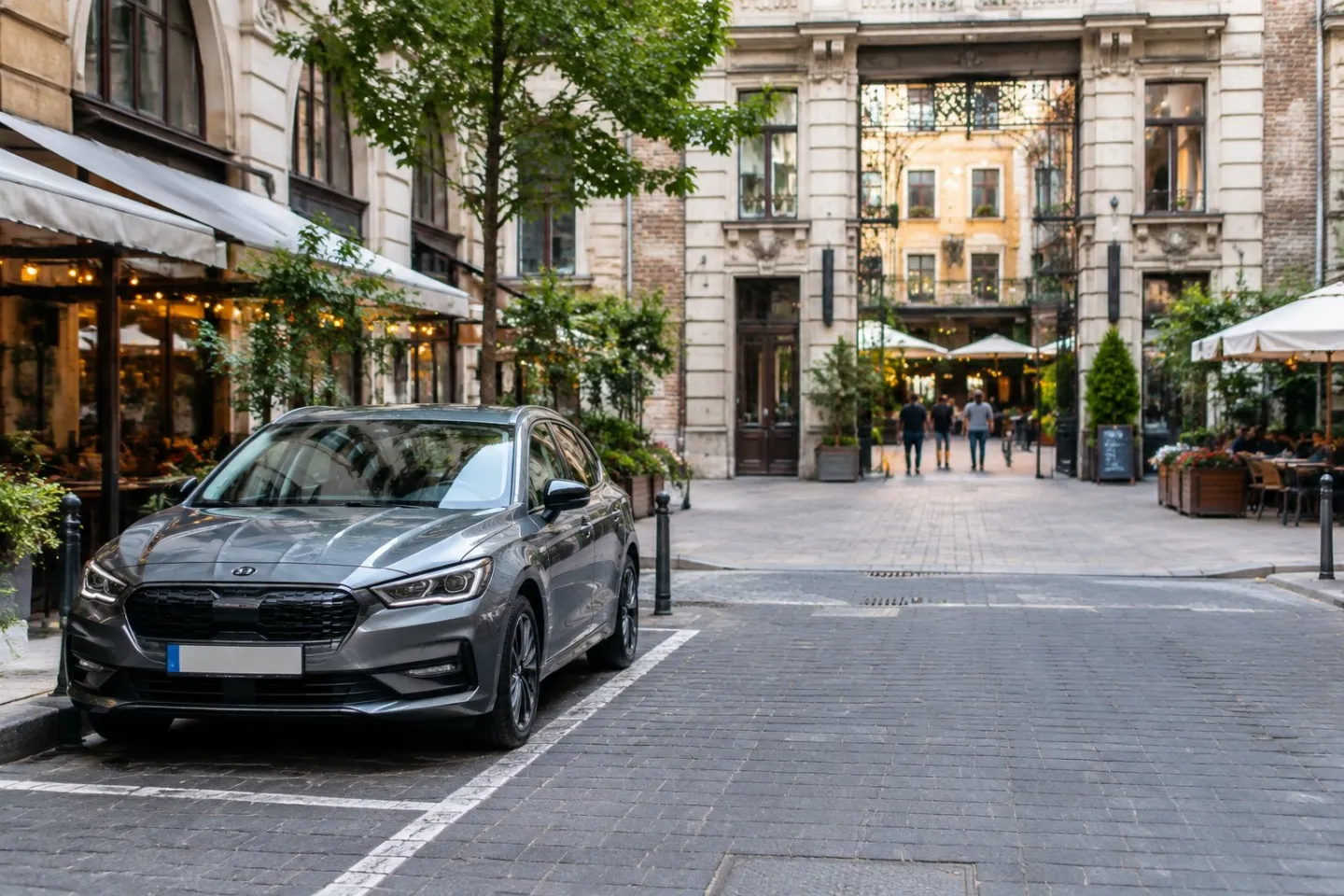 A car parked near the entrance to Gozsdu Courtyard in Budapest.